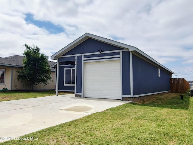 2834 E 7th St, Lubbock, TX 79403 - view of front of house featuring a front lawn, concrete driveway, and an attached garage