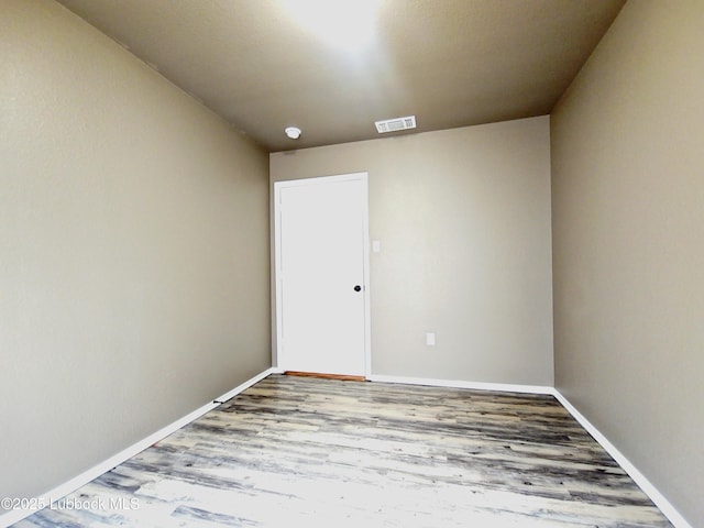 2834 E 7th St, Lubbock, TX 79403 - spare room with wood finished floors and baseboards