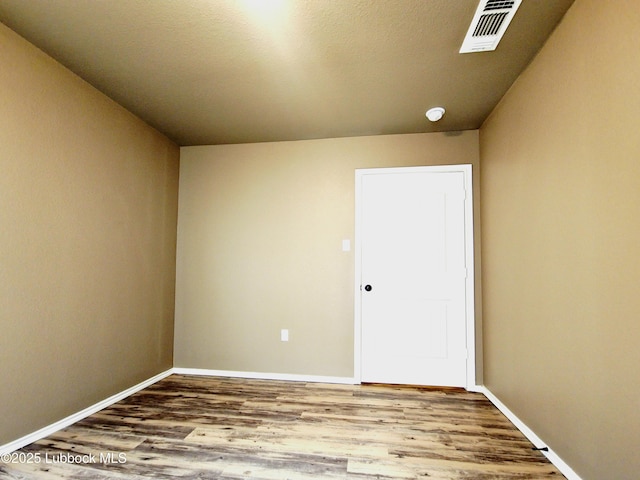 2834 E 7th St, Lubbock, TX 79403 - unfurnished room with wood finished floors and baseboards