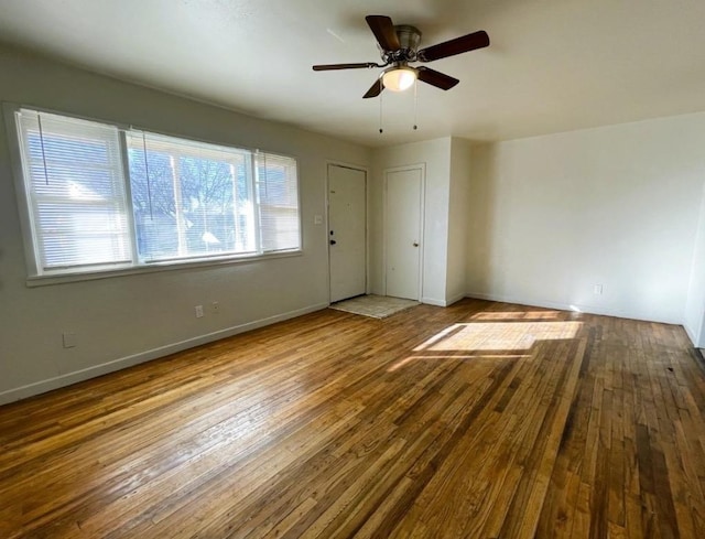 interior space featuring hardwood / wood-style floors and ceiling fan