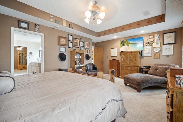 bedroom with carpet floors and ensuite bathroom