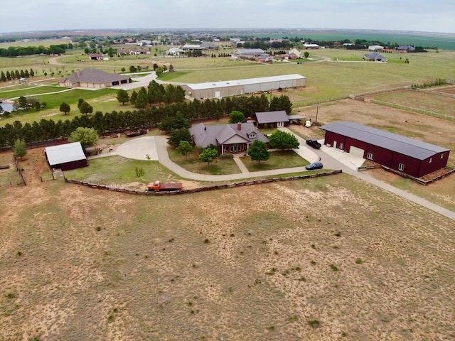 birds eye view of property featuring a rural view