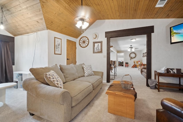 living room with lofted ceiling, wood ceiling, light colored carpet, and ceiling fan