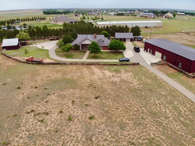 birds eye view of property featuring a rural view