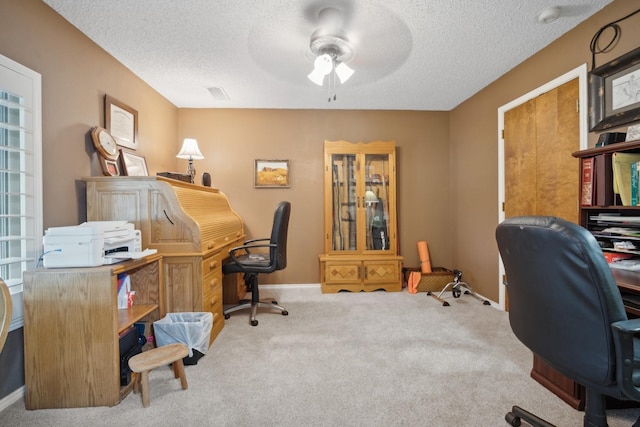 office with ceiling fan, light colored carpet, and a textured ceiling