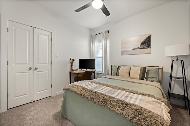 6937 12th St, Lubbock, TX 79416 - carpeted bedroom with a closet, baseboards, and a ceiling fan