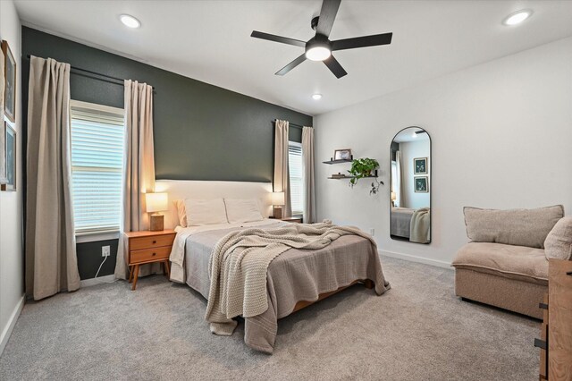6937 12th St, Lubbock, TX 79416 - carpeted bedroom with baseboards, arched walkways, ceiling fan, and recessed lighting