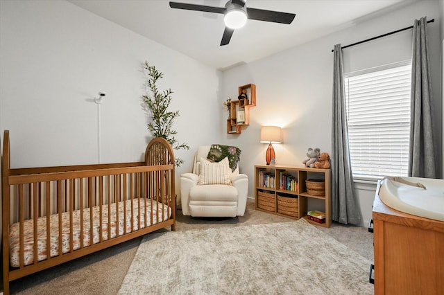 6937 12th St, Lubbock, TX 79416 - carpeted bedroom featuring ceiling fan and a nursery area