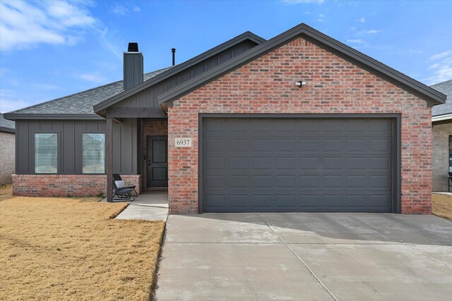 6937 12th St, Lubbock, TX 79416 - ranch-style home with brick siding, a garage, and board and batten siding