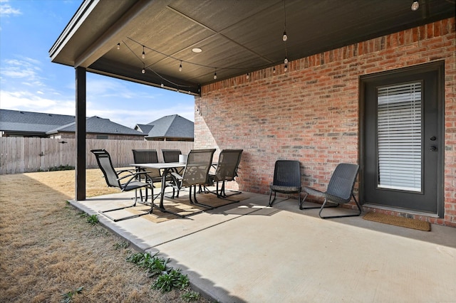 6937 12th St, Lubbock, TX 79416 - view of patio with fence and outdoor dining space