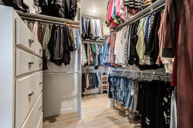 walk in closet featuring light hardwood / wood-style floors