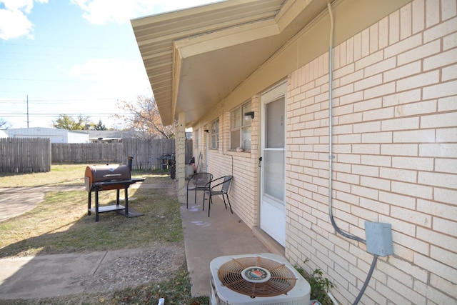 view of patio / terrace featuring area for grilling and central AC unit