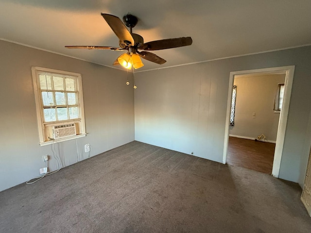 carpeted spare room featuring crown molding, cooling unit, and ceiling fan