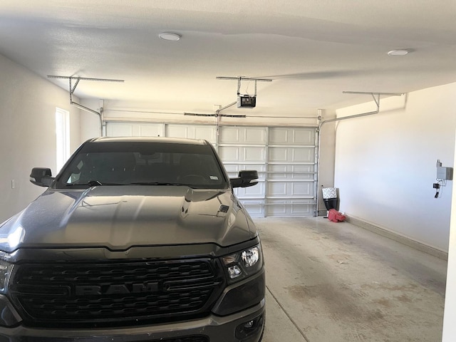 garage featuring a garage door opener