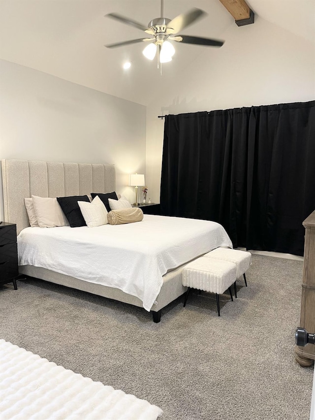 carpeted bedroom featuring lofted ceiling with beams and ceiling fan