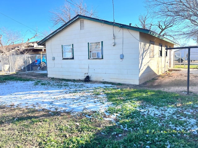 snow covered property with cooling unit