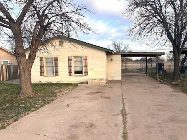 view of property exterior with a carport