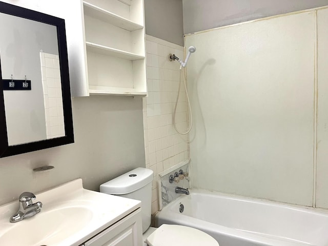 full bathroom with vanity, toilet, and tiled shower / bath