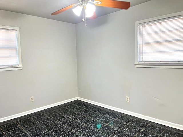 empty room featuring ceiling fan