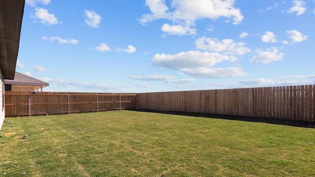 view of yard featuring a fenced backyard