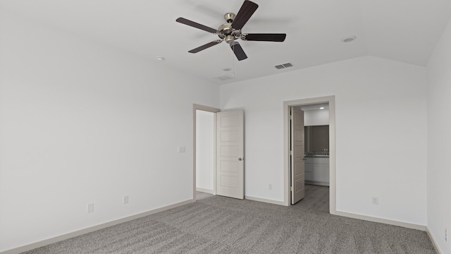 unfurnished bedroom with baseboards, visible vents, carpet floors, and ceiling fan