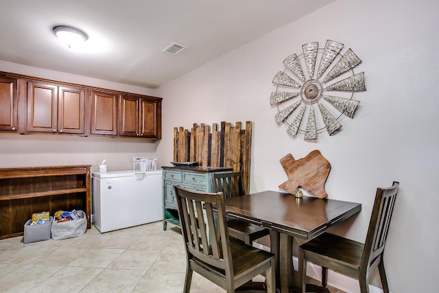 5810 116th St, Lubbock, TX 79424 - dining area with light tile patterned floors and visible vents