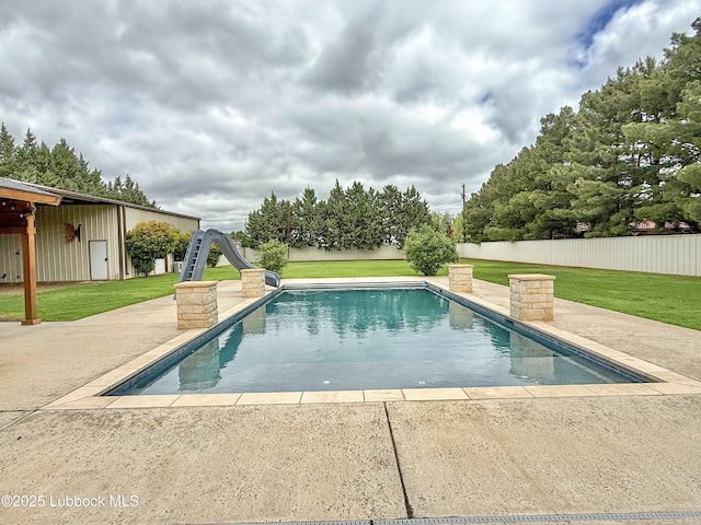 5810 116th St, Lubbock, TX 79424 - view of pool with fence, a yard, a patio, a water slide, and a fenced in pool