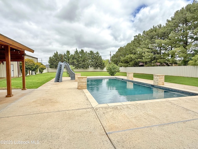 5810 116th St, Lubbock, TX 79424 - view of pool with a fenced in pool, a water slide, fence, a yard, and a patio area