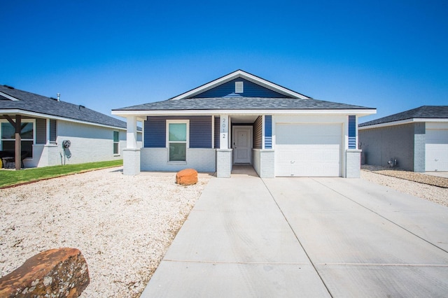 view of front of property featuring a garage and a porch