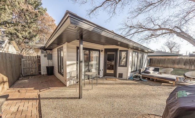 rear view of property featuring a patio