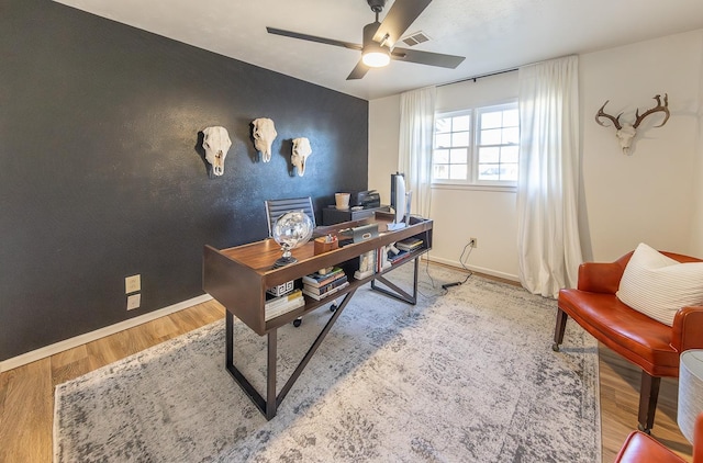 office with hardwood / wood-style floors and ceiling fan