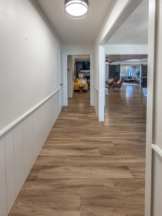 hallway with wood-type flooring