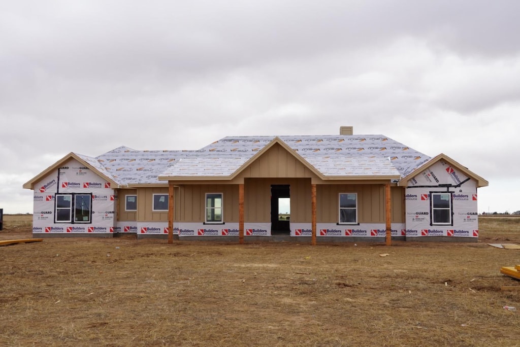 unfinished property with a front lawn