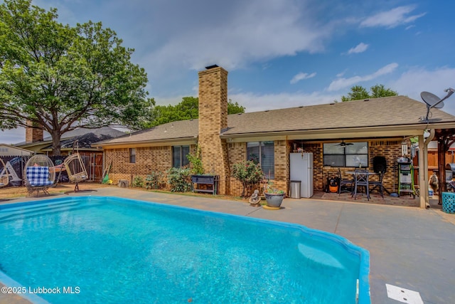 5417 89th St, Lubbock, TX 79424 - pool with a ceiling fan, a patio area, and fence