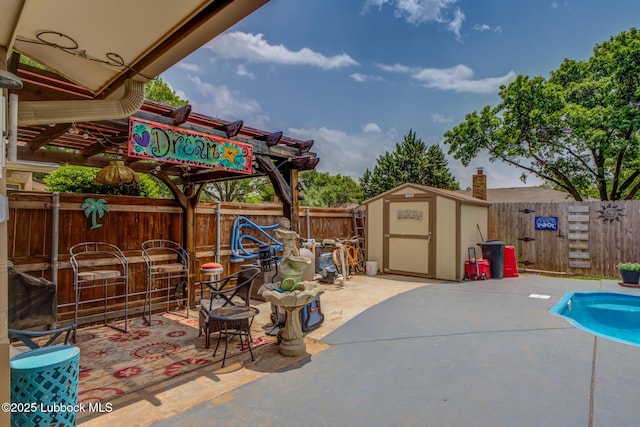 5417 89th St, Lubbock, TX 79424 - view of patio with a storage unit, an outdoor structure, a fenced backyard, and a fenced in pool