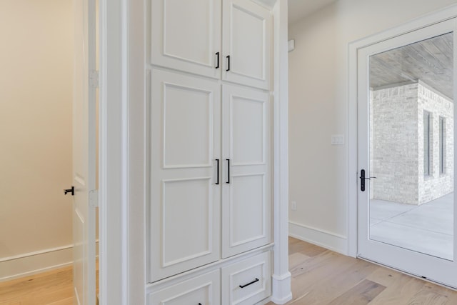 interior space with light wood-type flooring and baseboards