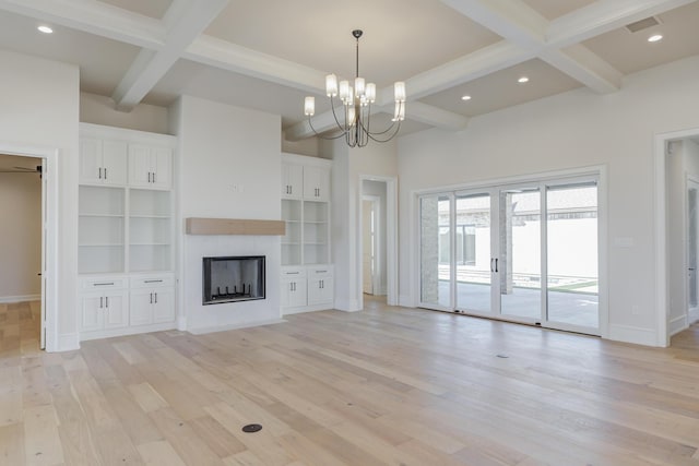 unfurnished living room featuring coffered ceiling, beamed ceiling, baseboards, and light wood-style flooring