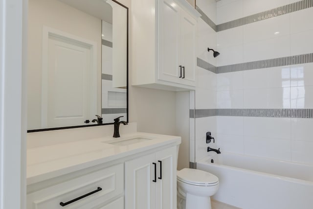 bathroom featuring vanity, toilet, and shower / washtub combination