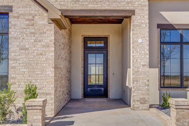 doorway to property with stucco siding