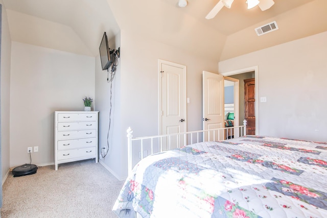 carpeted bedroom featuring vaulted ceiling, ceiling fan, visible vents, and baseboards