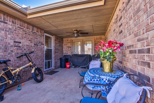 view of patio featuring a ceiling fan, french doors, and grilling area