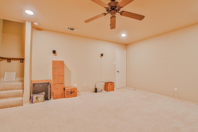 spare room with carpet floors, recessed lighting, visible vents, ceiling fan, and stairs