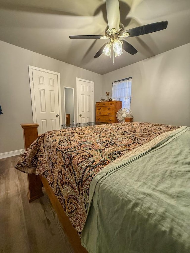 bedroom featuring dark wood-type flooring and ceiling fan
