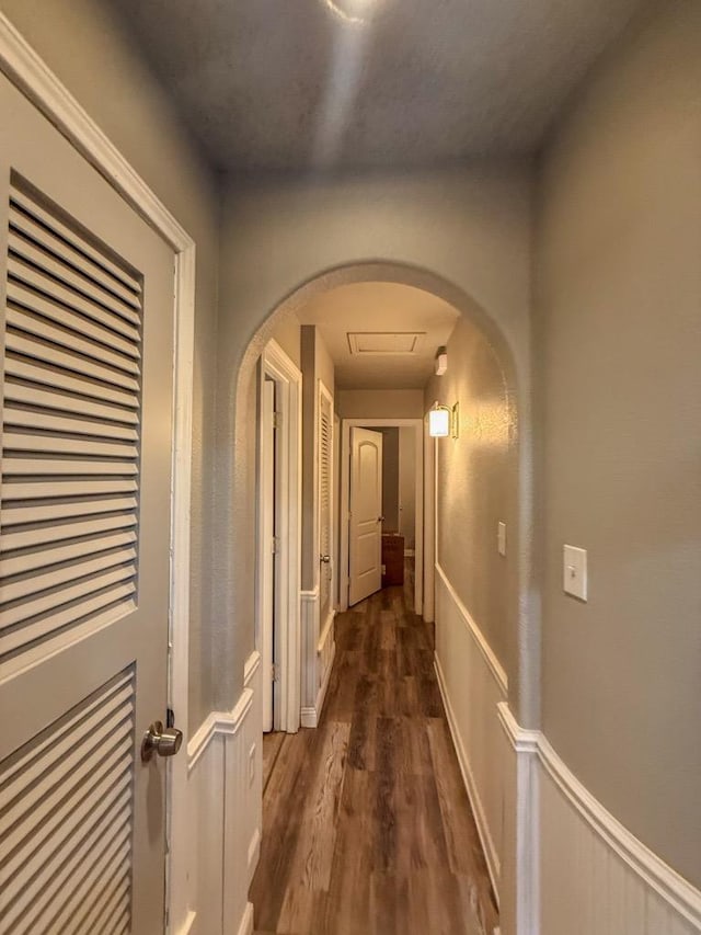 corridor featuring dark wood-type flooring