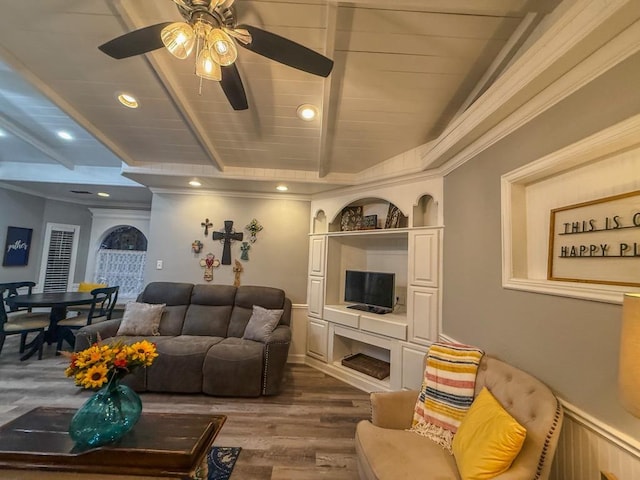 living room with beamed ceiling, dark wood-type flooring, and ceiling fan