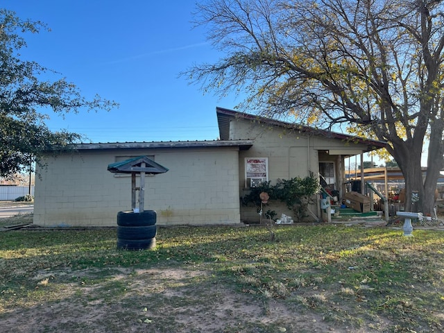 view of outbuilding with a yard