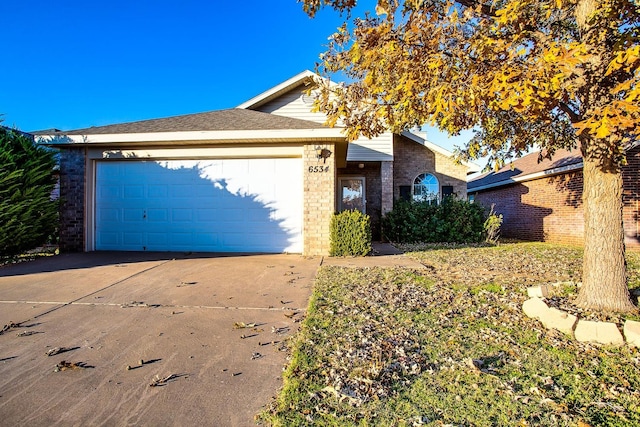 ranch-style home featuring a garage