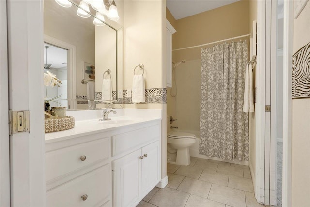 full bathroom with tile patterned flooring, vanity, shower / tub combo, and toilet