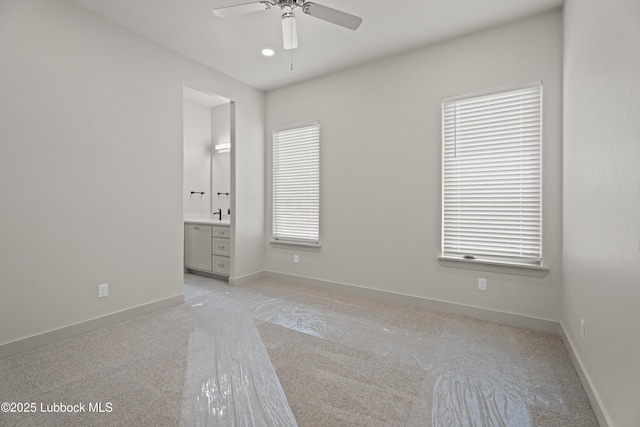 4614 138th Pl, Lubbock, TX 79424 - spare room featuring ceiling fan and light carpet