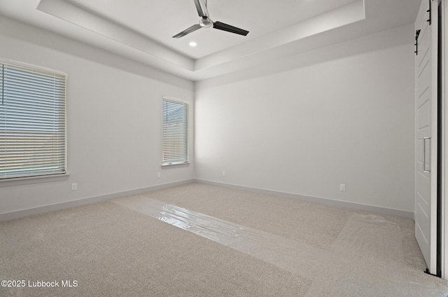 4614 138th Pl, Lubbock, TX 79424 - spare room with a raised ceiling, ceiling fan, healthy amount of natural light, light carpet, and recessed lighting